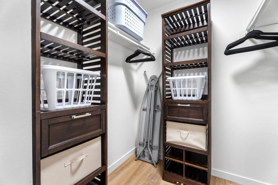 Large Walk-In closet with built-in features.  Iron & Ironing Board.