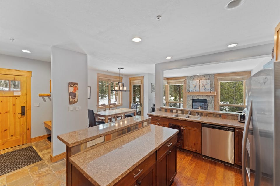 Your gourmet kitchen features granite countertops, stainless appliances, and warm wood cabinetry—perfect for preparing meals together.