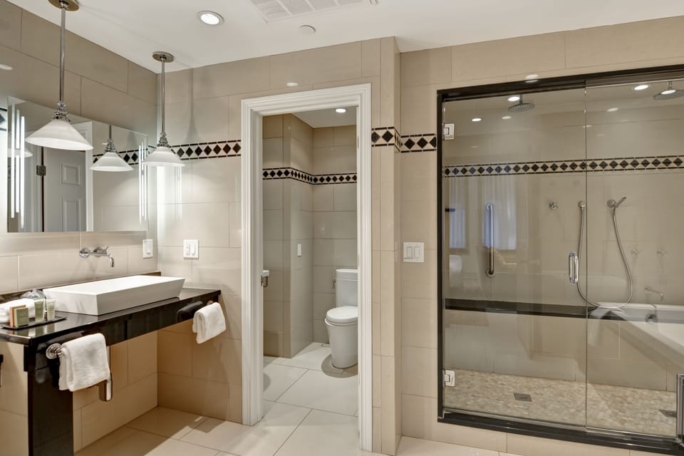 Designer toiletries, hair dryer, bathrobes, towels