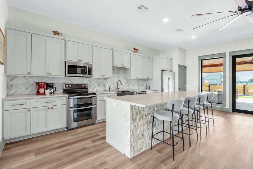 The open kitchen has bar seating for four