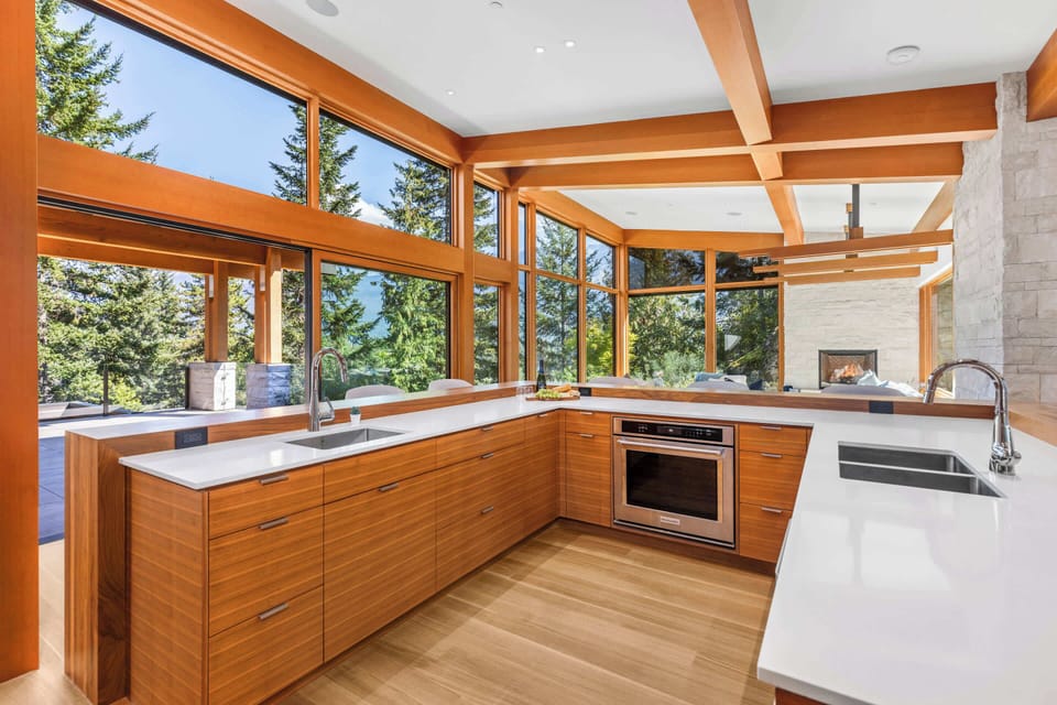 Chef’s kitchen w/ dual sinks, generous counters, and a bright, airy layout for easy cooking.