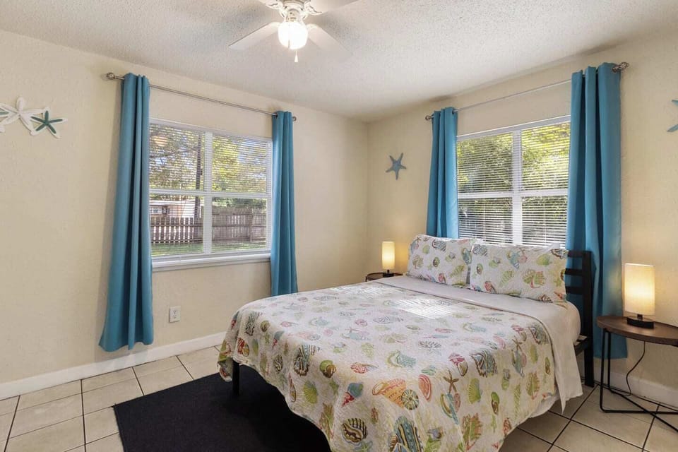 A quiet, well-lit bedroom designed for restful sleep and comfort. With a comfortable bed, ceiling fan, and uncluttered setup, this space works especially well for business travelers, nurses, or guests staying longer.