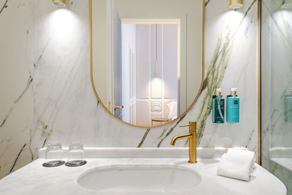 Designer toiletries, hair dryer, bathrobes, towels