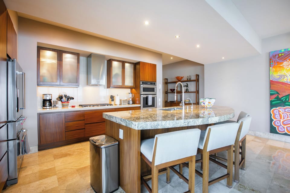 Fully equipped kitchen with modern appliances and elegant finishes