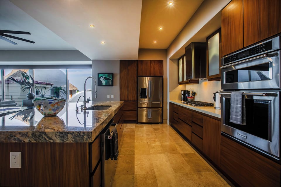 Gourmet kitchen with granite countertops and modern appliances