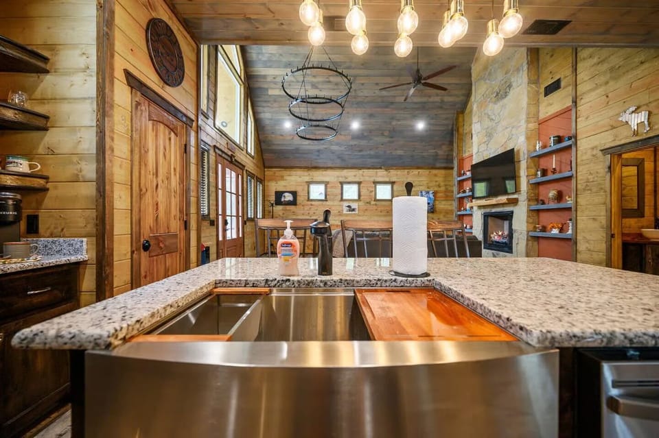 Cook memorable meals in your gourmet kitchen featuring granite counters, modern appliances, and rustic charm that flows seamlessly into the living space.
