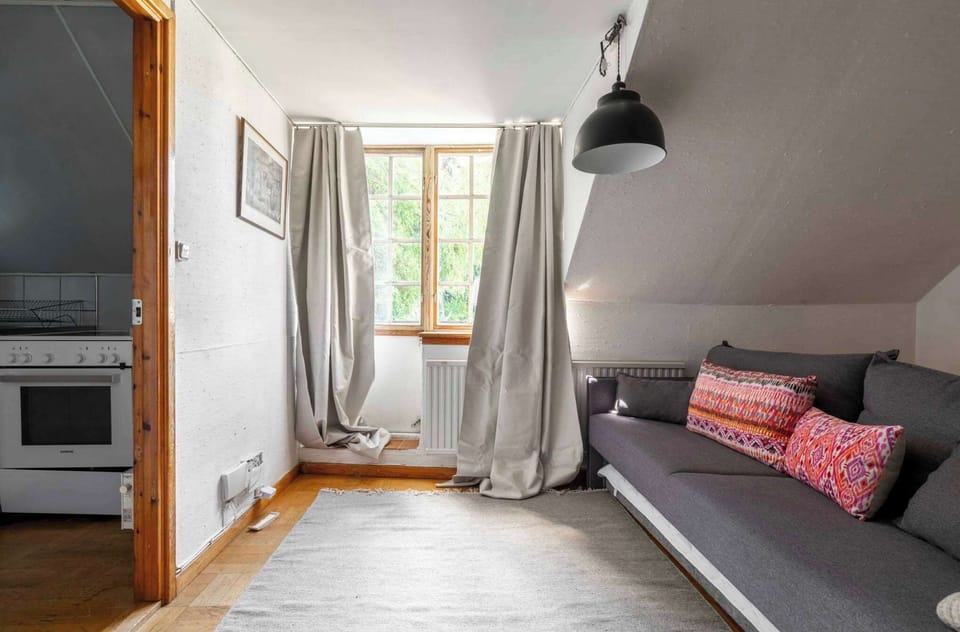 The living room is bright with a terrace adjacent