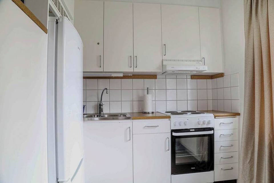 The kitchen is fully equipped with a stovetop, microwave, oven, fridge, freezer, kettle, coffee maker and essentials.