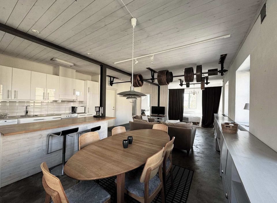 Dining area with a table that can comfortably fit 6 guests.