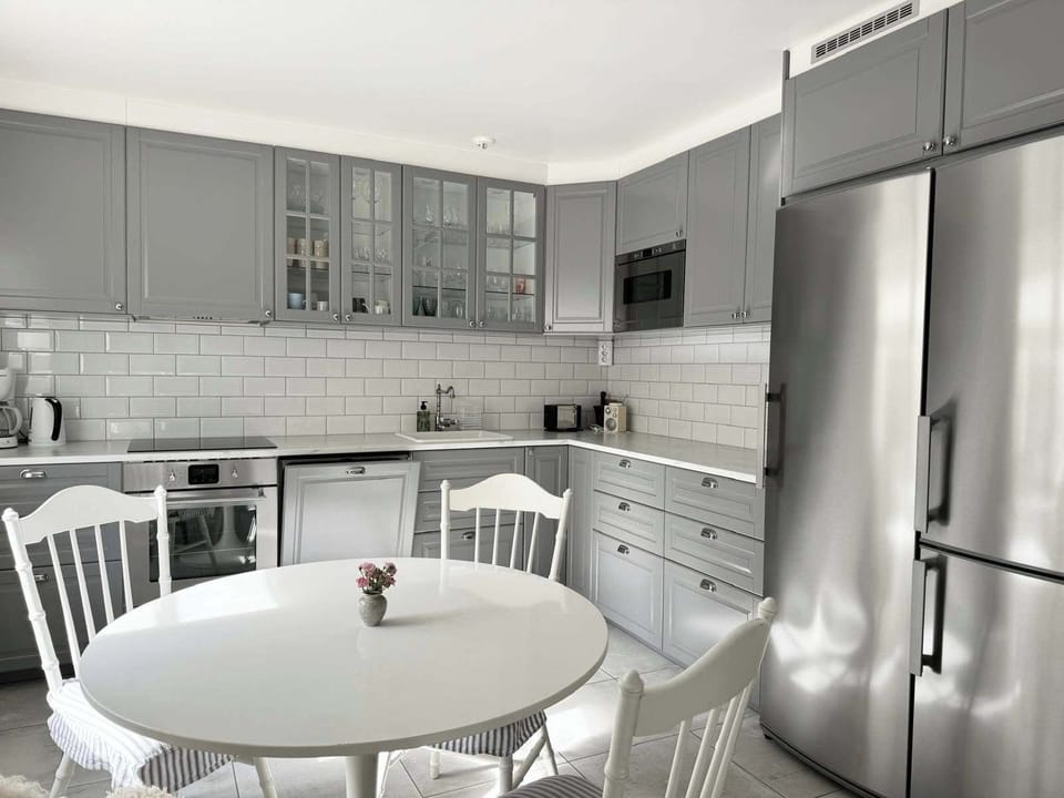 Another view of the elegant, fully equipped kitchen, were you see the spacious fridge and freezer.