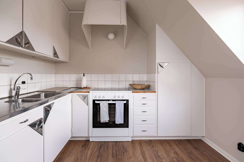 The fully equipped kitchen with all essentials you will need for a home cooked meal. There is a stove, oven, fridge, freezer, kettle, coffee maker, toaster, microwave and essentials.