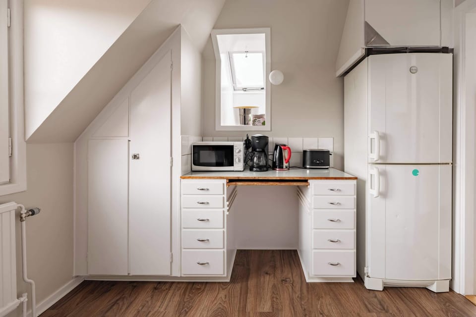 The fully equipped kitchen with all essentials you will need for a home cooked meal. There is a stove, oven, fridge, freezer, kettle, coffee maker, toaster, microwave and essentials.