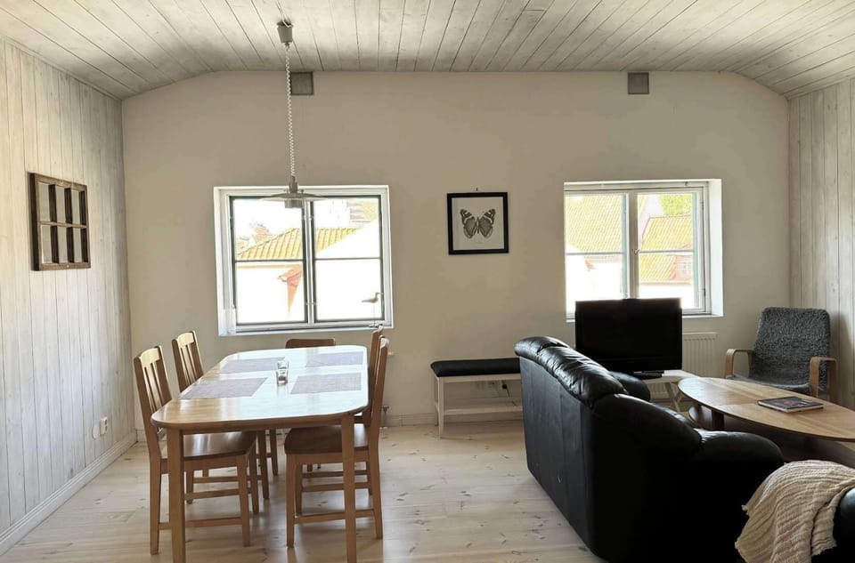 Dining area with a table that can comfortably fit 6 guests.