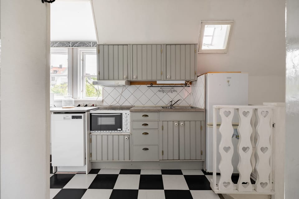 The fully equipped kitchen with all essentials you will need for a home cooked meal. There is a stove, oven, dishwasher, fridge, freezer, microwave, kettle and coffee maker.