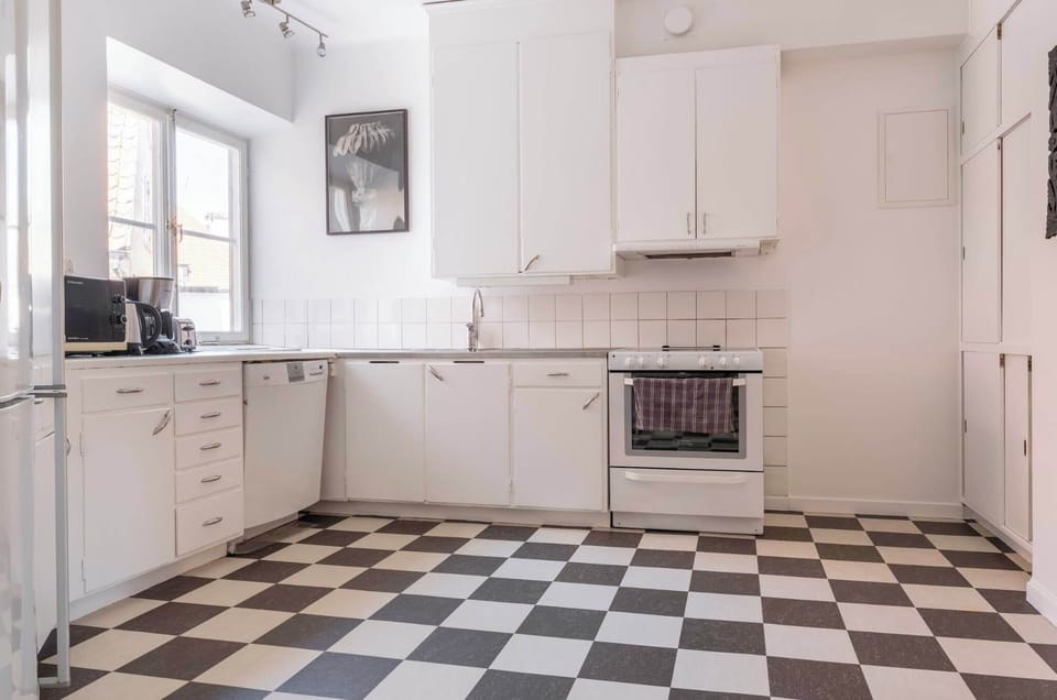 A fully equipped kitchen with dishwasher and microwave.