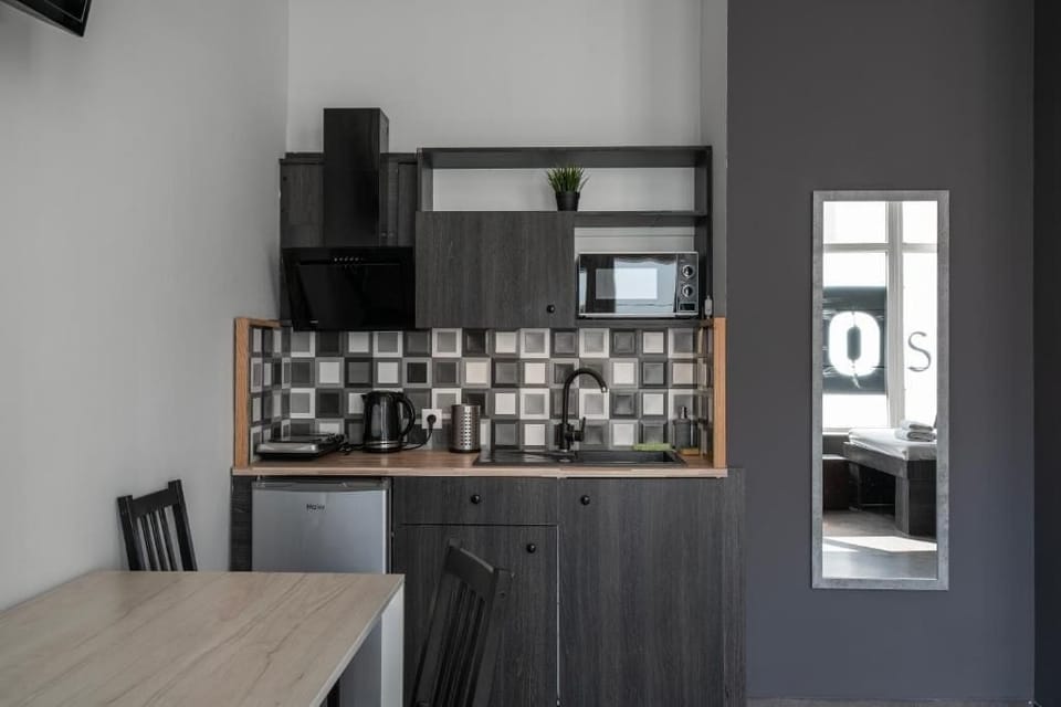 Classic Quadruple Room, Courtyard View | Private kitchen | Shared fridge, microwave