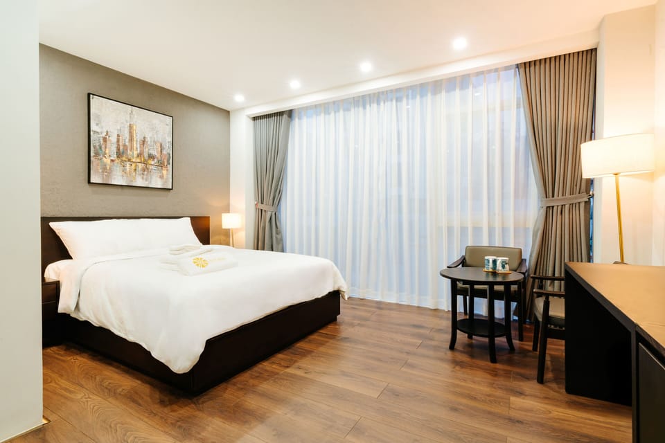 Deluxe Double Room Single Use, City View | Minibar (free items), in-room safe, desk, laptop workspace