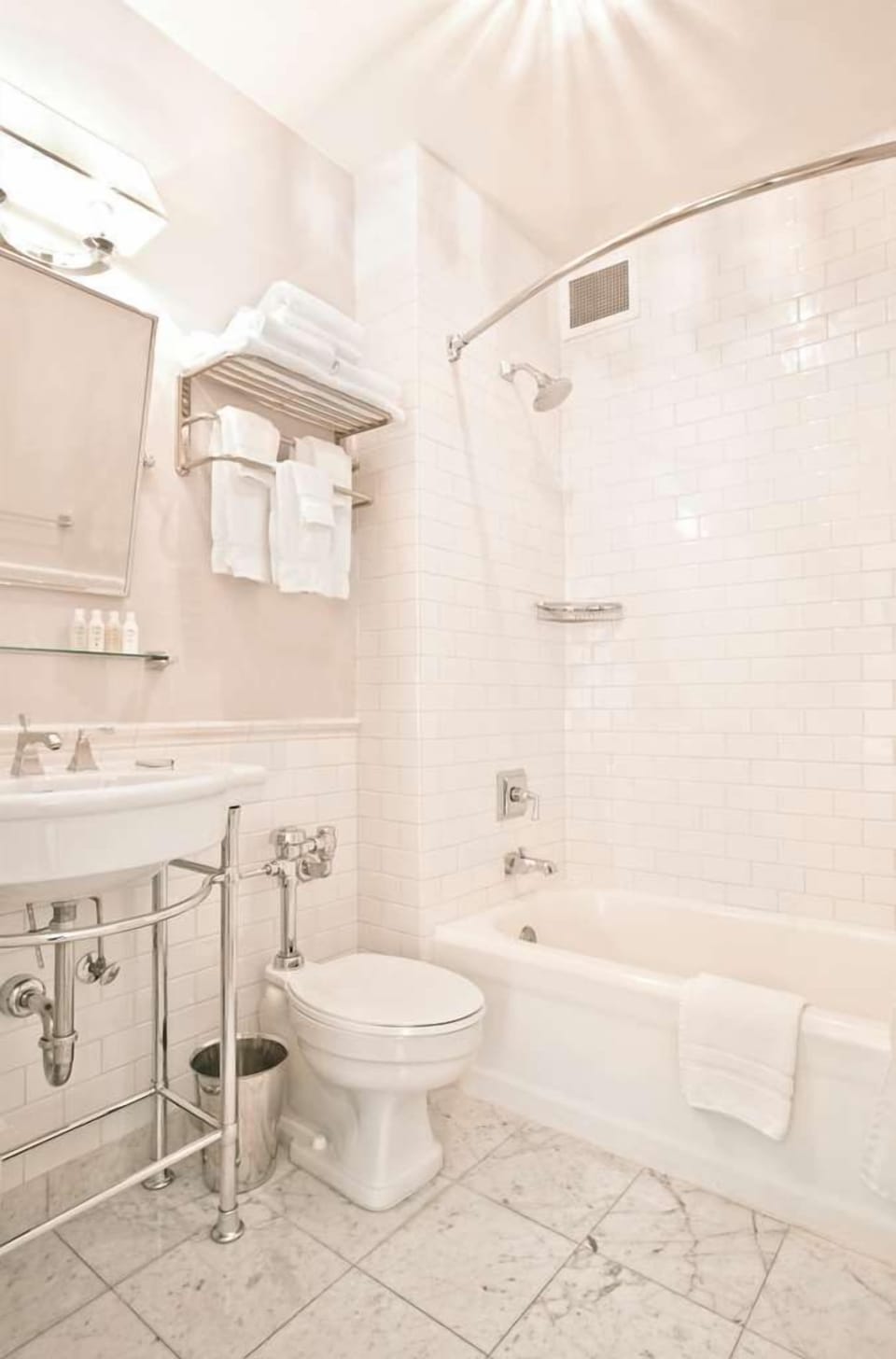 Our elegant bathroom features contemporary fixtures, a spacious design, and all the essentials for your convenience.