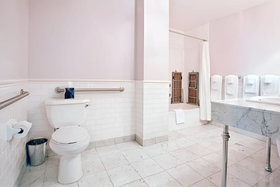 Our luxurious bathroom features modern fixtures, a spacious layout, and premium toiletries for your comfort.