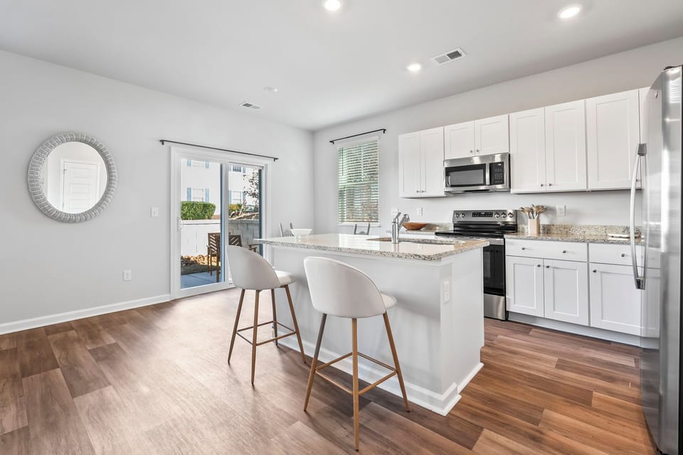 Modern kitchen with granite countertops and stainless steel appliances
