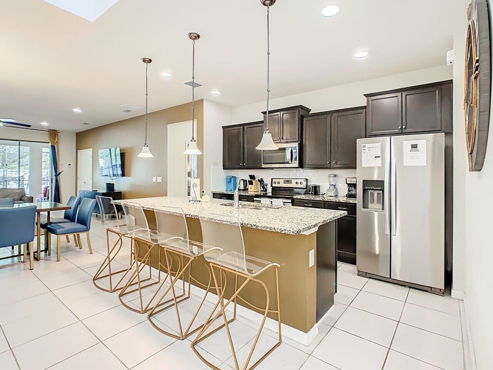 Modern kitchen with breakfast bar & stainless appliances