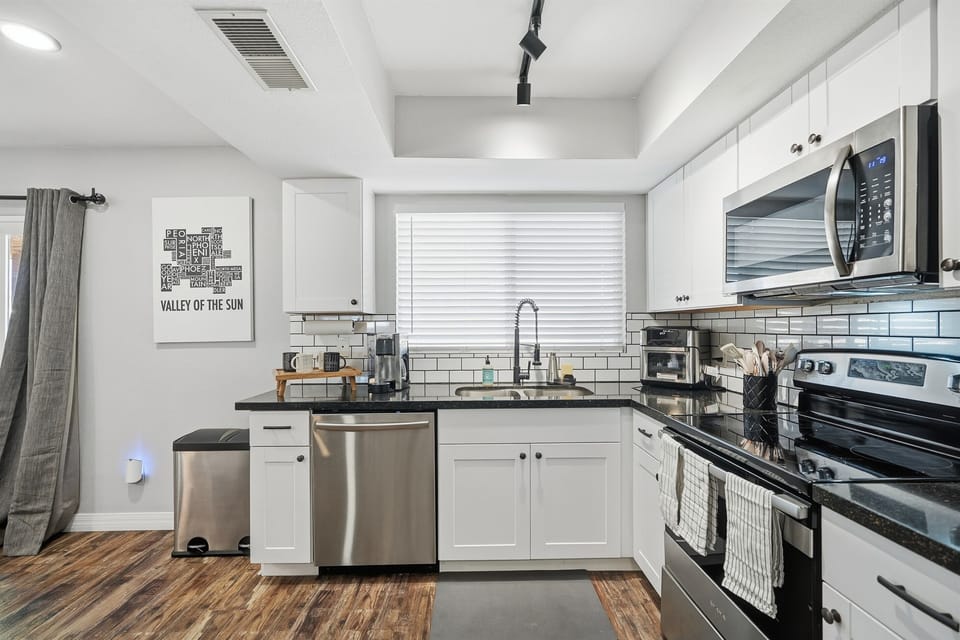 Cook with ease in this bright, modern kitchen—fully equipped for everything from quick breakfasts to home-cooked dinners.