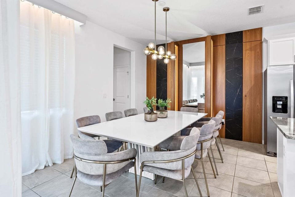 Enjoy meals together in the dining room with seating for 8.