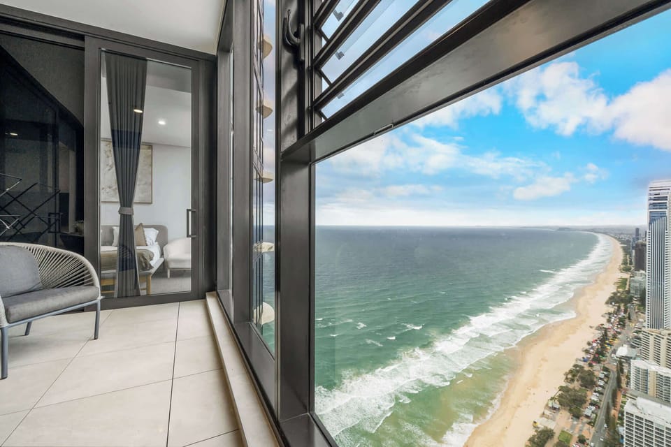 Relax on the balcony and take in panoramic views of the ocean, beach, and city skyline below.
