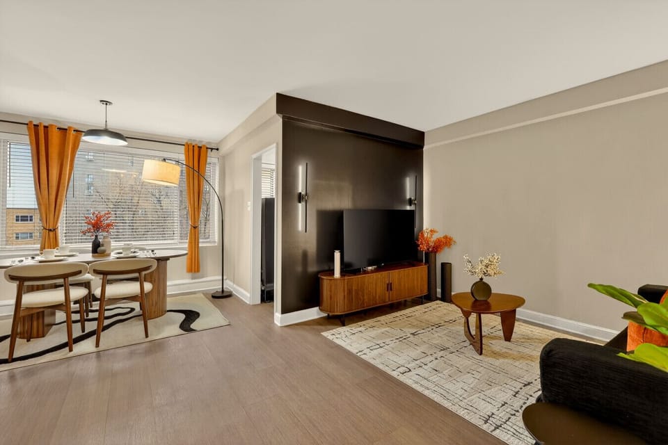 Settle into the inviting living room, complete with comfortable furnishings and plenty of space to relax and connect.