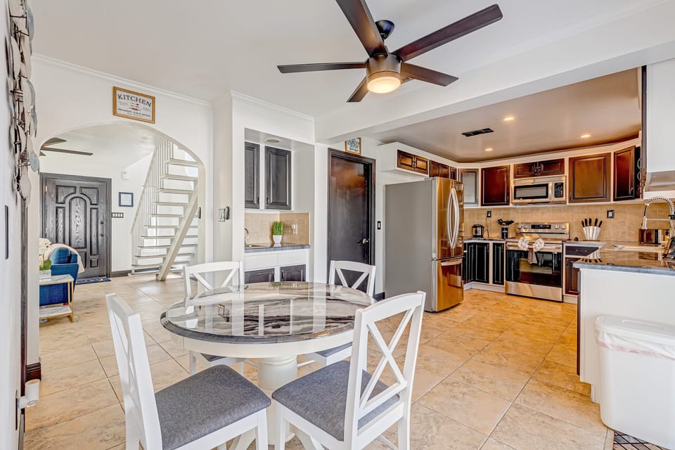 The kitchen and dining area feature an open floor plan for a pleasurable dining experience.
