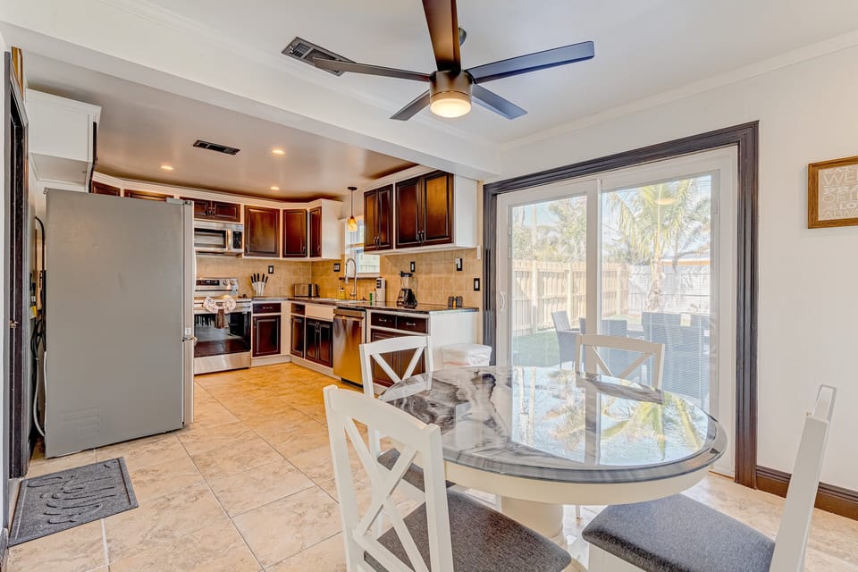 The kitchen and dining area feature an open floor plan for a pleasurable dining experience.