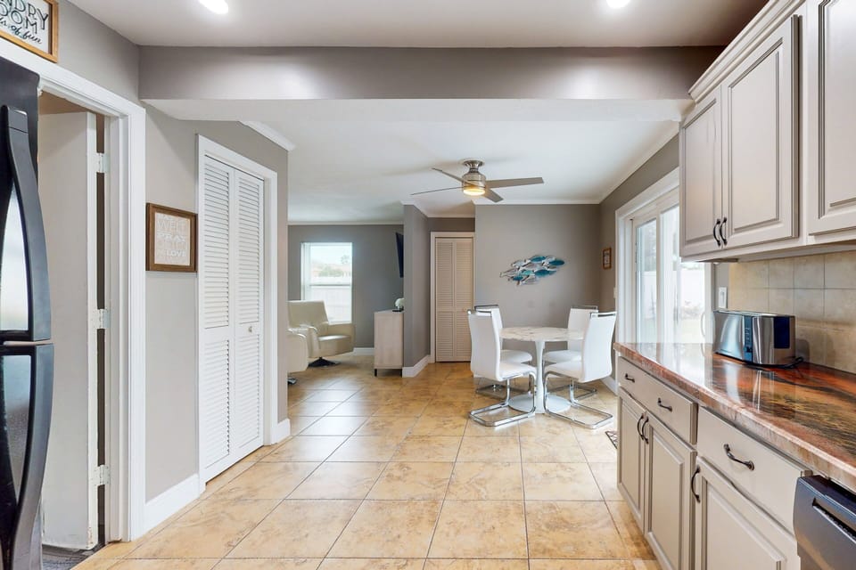 The kitchen and dining area feature an open floor plan for a pleasurable dining experience.