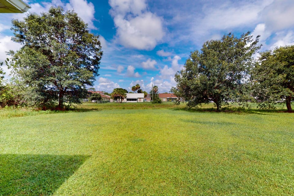 The backyard is large and spacious.