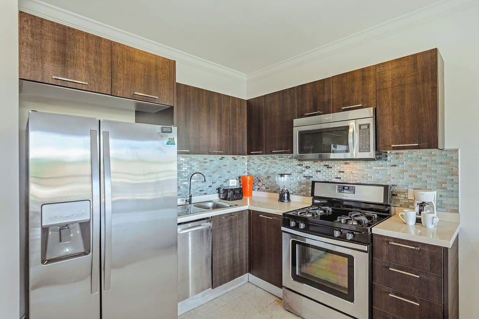 Fully equipped kitchen with stainless steel appliances, modern cabinetry, and everything you need to cook and dine comfortably.