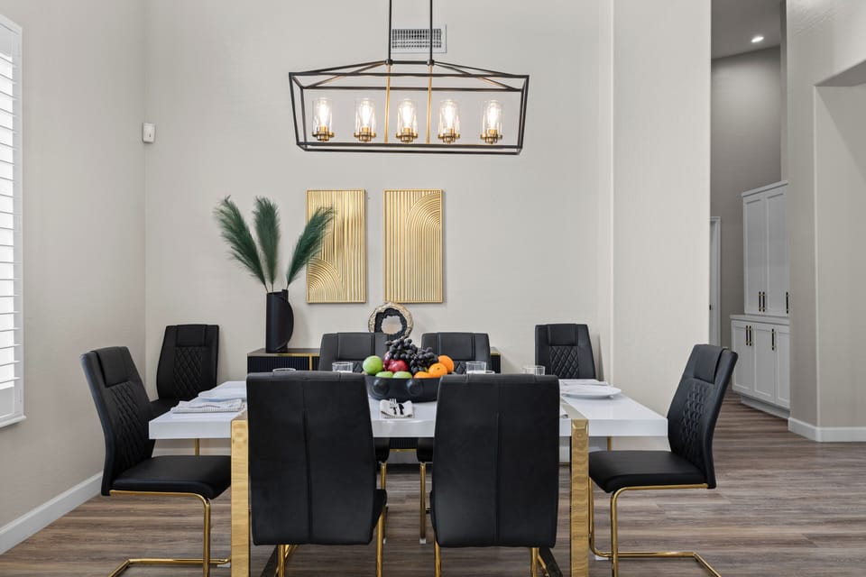 Full view of the formal dining set with decorative wall art.