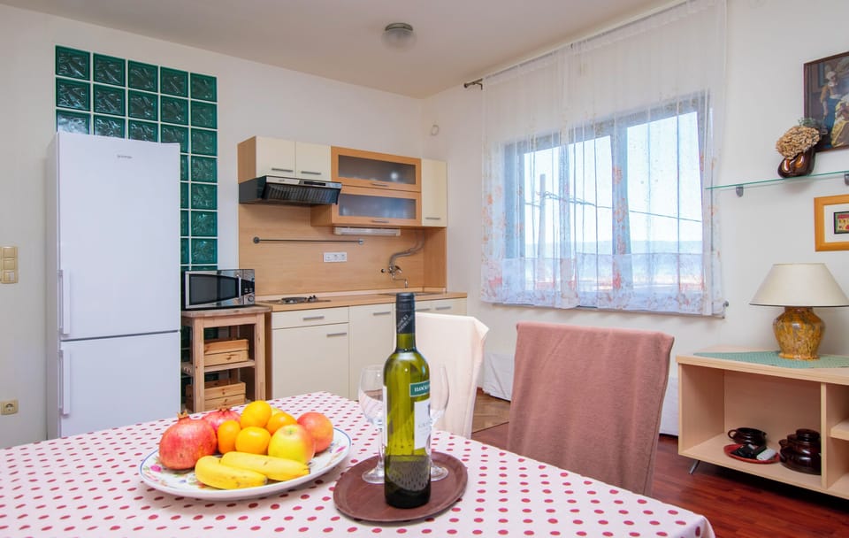 Apartment (A1) | Private kitchen | Fridge, microwave, stovetop, dishwasher