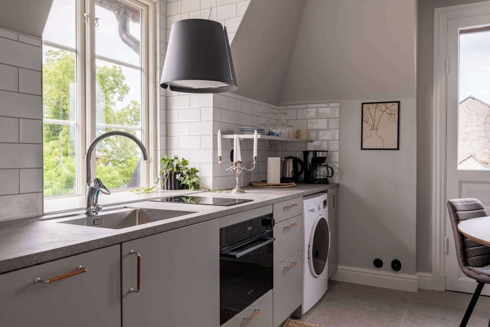 Fully equipped kitchen with all essentials you will need for a home cooked meal. There is a stove, oven, fridge, freezer, coffee maker and water boiler, toaster and essentials. A nice seating area in the kitchen for 4 guests.