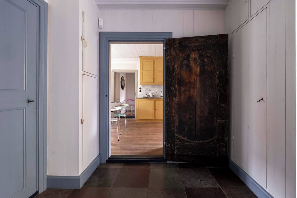 Views from the hallway into the kitchen and dining area.