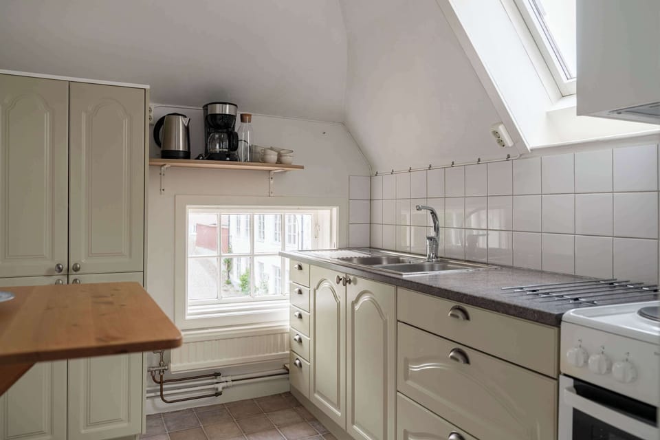 View of the kitchen where you will have space to prepare your own meals.