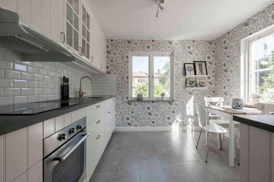 A view of the beautiful kitchen with a dining table and wonderful view.