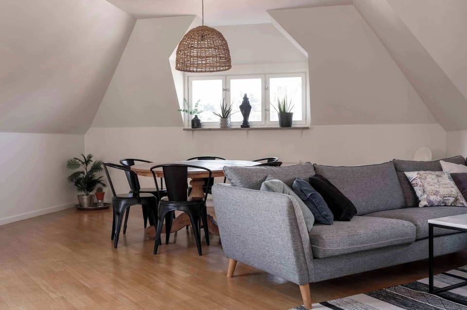 Spacious and stylish living and dining area, perfect for relaxing, entertaining, or enjoying meals together.
