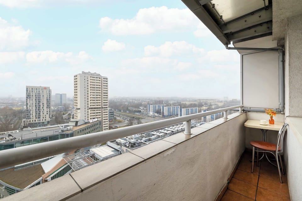 City view visible from the balcony.