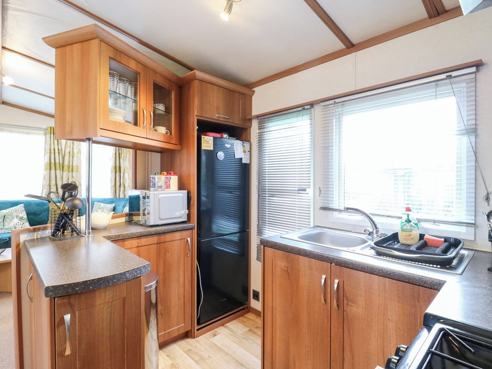 Fridge, microwave, toaster, cookware/dishes/utensils