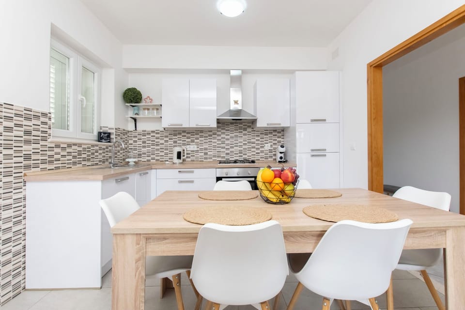 Apartment (A1) | Private kitchen | Fridge, microwave, stovetop, dishwasher