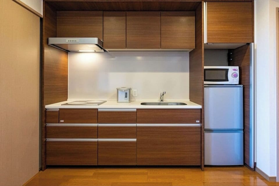 Panoramic Suite, Balcony, City View | Private kitchen | Fridge, microwave, stovetop, electric kettle