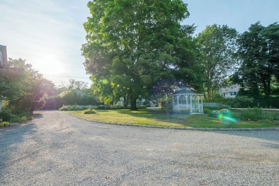 Late afternoon picture of gazebo and side yard offering plenty of shade and moments with loved ones!