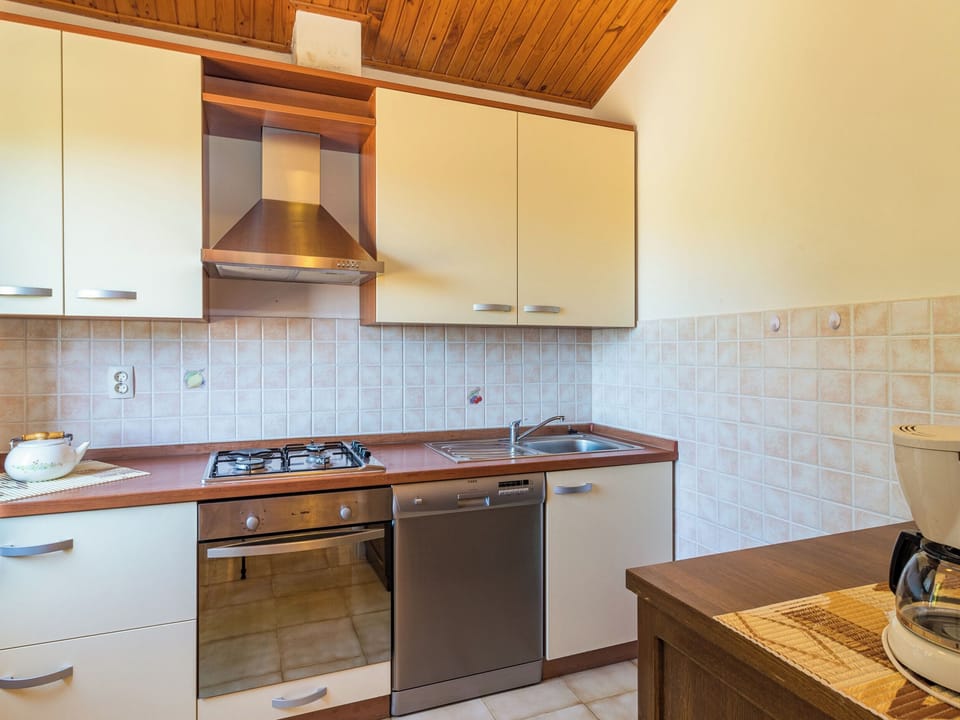 Villa | Private kitchen | Fridge, microwave, oven, stovetop