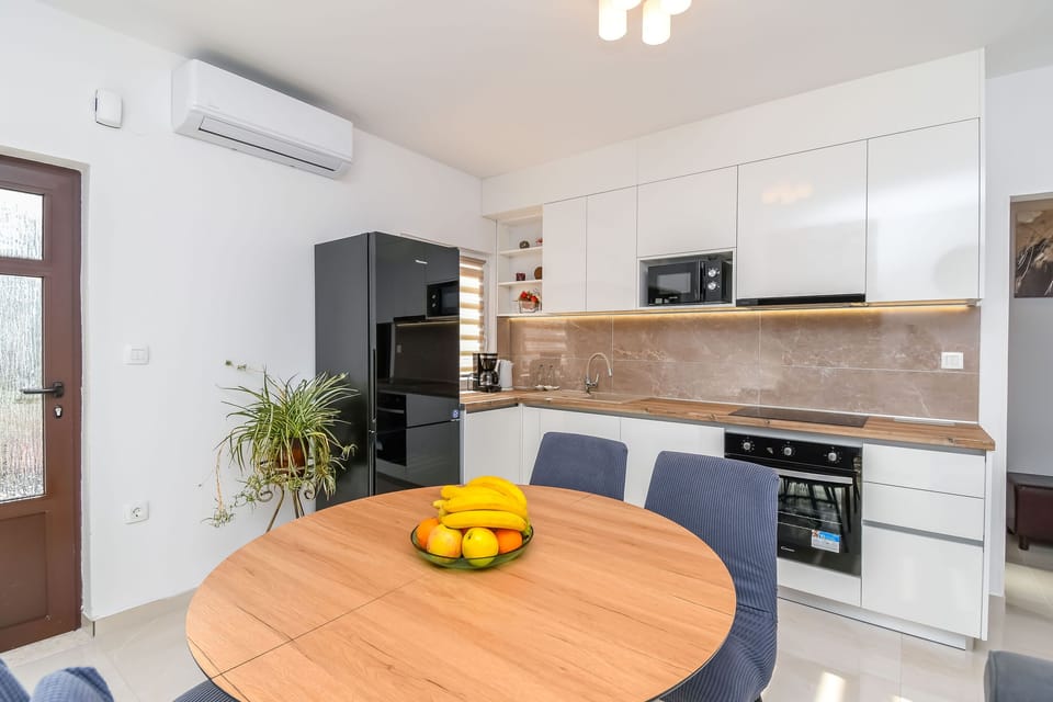 Apartment (A2) | Private kitchen | Fridge, microwave, oven, stovetop