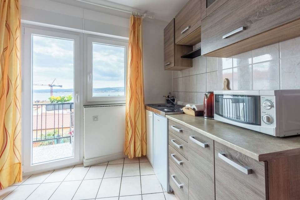 Apartment (A1) | Private kitchen | Mini-fridge, microwave, stovetop, espresso maker