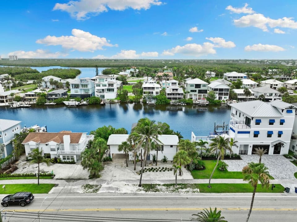 Aerial of bayfront neighborhood with direct Gulf beach access nearby